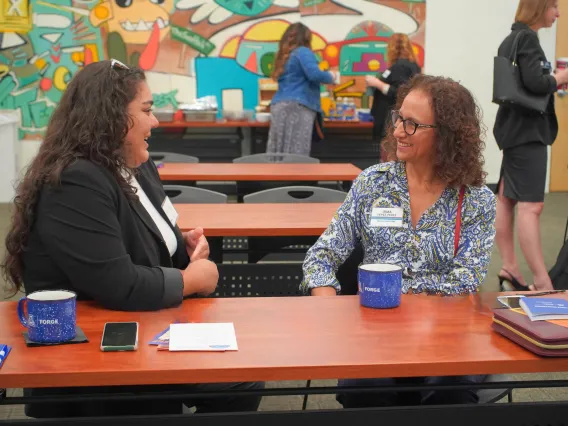 Two Native FORGE conference participants in conversation