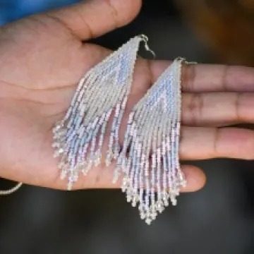 A pair of beaded earrings made by Tommey Jodie, who will sell her work on Student-Made Arizona in the fall.