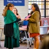 Nicolette Gomez, right, presents a certificate to Suzie Francisco